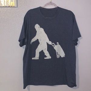 Gray Bigfoot pulling golf clubs short sleeve top